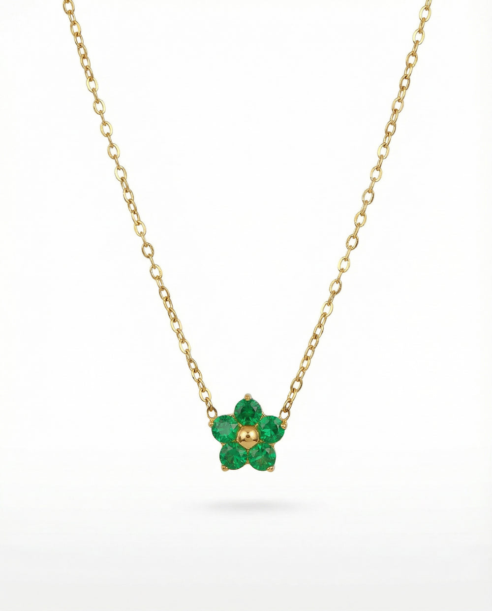 ZLATNI CVET SA ZELENIM CIRKONIMA